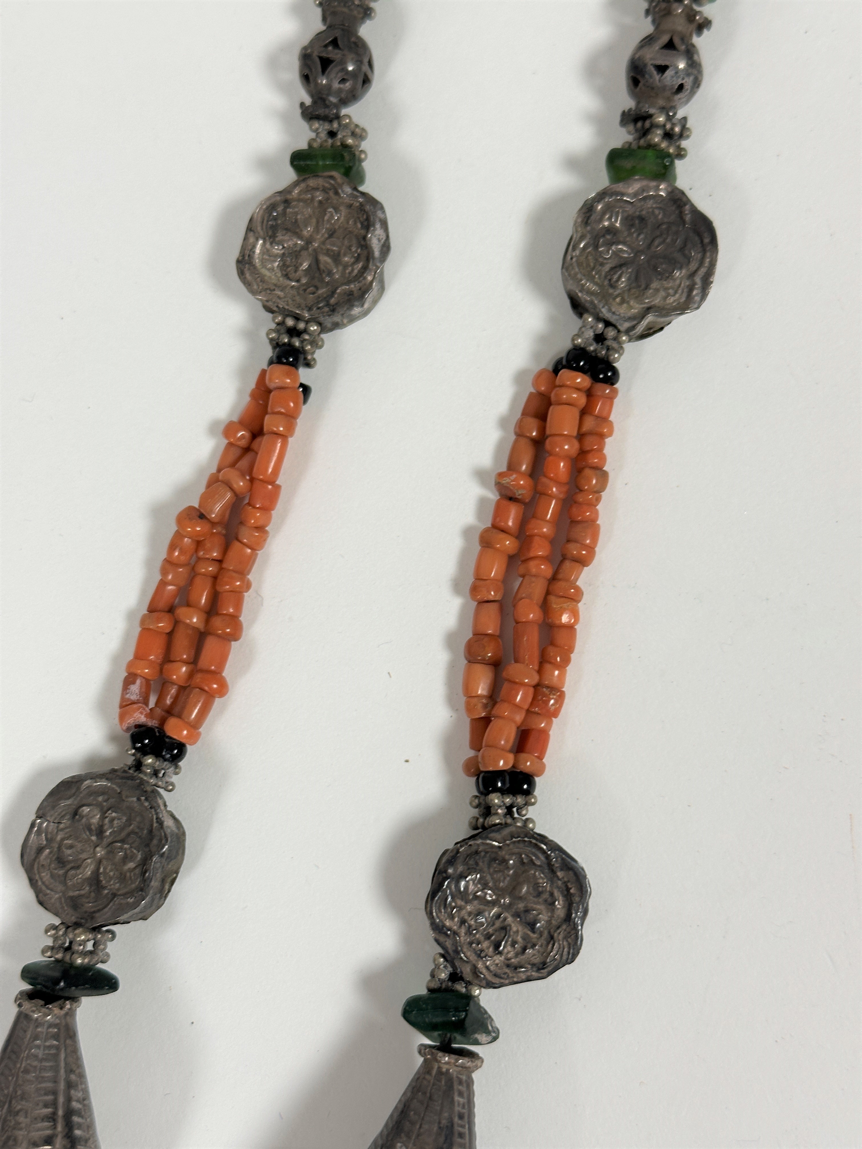 A Middle Eastern necklace set white metal discs and green glass beads, with triple strand pink coral - Image 2 of 2