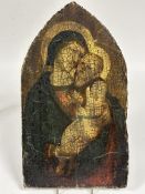 A reproduction varnished paper icon mounted on antique pine arched panel depicting Mary and Jesus