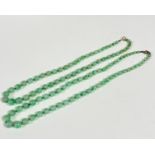A double strand of celadon jadeite graduated beads, formed as one strand (22cm and 20cm)