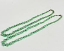 A double strand of celadon jadeite graduated beads, formed as one strand (22cm and 20cm)