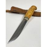 A mid to late 20th century Finish survival knife, 4" blade, carved maple? handle, complete with