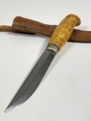 A mid to late 20th century Finish survival knife, 4" blade, carved maple? handle, complete with