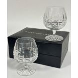 A pair of Waterford Irish Crystal brandy snifters with slice cut decoration (13cm x base: 8cm),