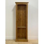 A late 20th century pine floor standing open bookcase, fitted with one fixed shelf (lacking