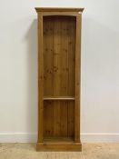 A late 20th century pine floor standing open bookcase, fitted with one fixed shelf (lacking