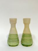 A pair of Art Nouveau style iridescent trailed glass vases with narrow neck tapering to a widened