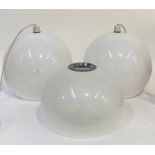 A pair of Vintage pendent light fittings, each with white translucent moulded polyurethane spherical