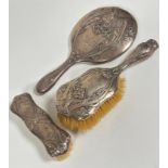 An Edwardian Chester Art Nouveau style hairbrush and hand brush with engraved cypher GSR and