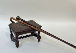 A wooden twisted walking stick with scroll handle (l-92cm), a coromandel cane with cast metal