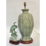 A celadon soapstone carving of a heron on a wooden fitted base (h- 30cm w- 14cm) and a large
