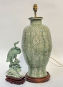 A celadon soapstone carving of a heron on a wooden fitted base (h- 30cm w- 14cm) and a large