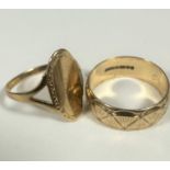 A 9ct gold oval panel signet style ring with open shoulders (P/Q) and a 9ct gold panelled and
