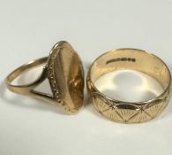 A 9ct gold oval panel signet style ring with open shoulders (P/Q) and a 9ct gold panelled and