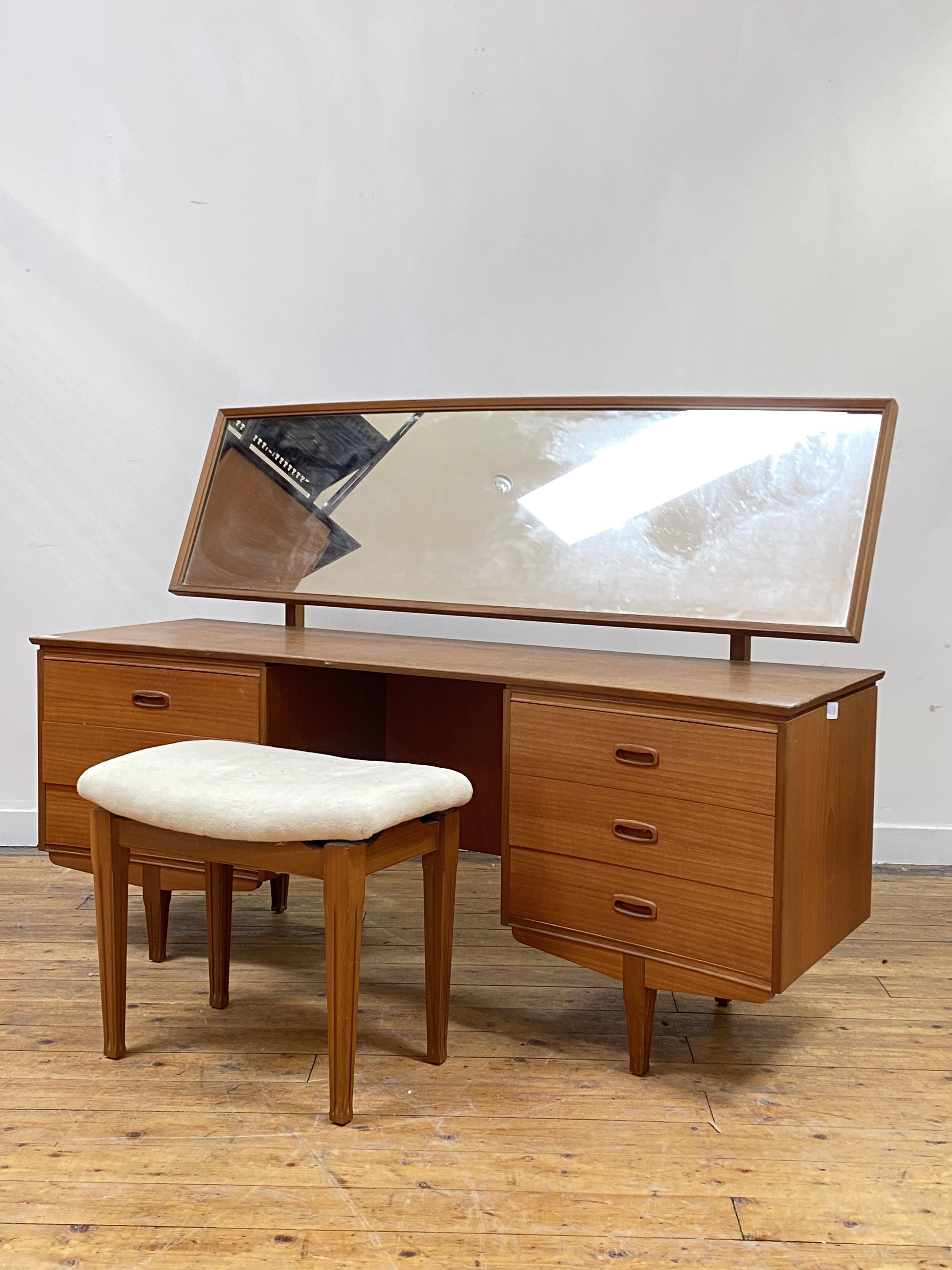 A mid century teak dressing table, circa 1960's, the arched rectangular mirror plate over a - Image 2 of 2