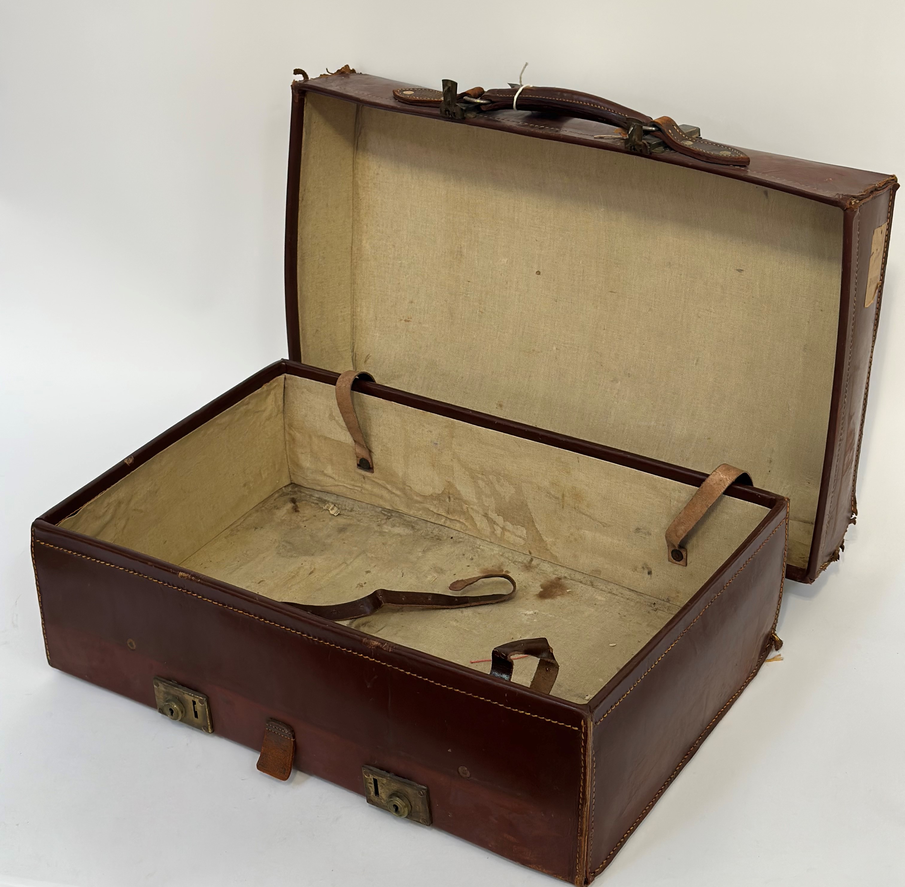 A early 20thc brown leather suitcase with brass locks, with linen fitted interior and leather - Image 2 of 3