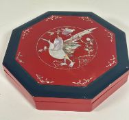 A Japanese red and black lacquered octagonal serving dish box complete with a set of compartments,