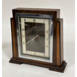 An Art Deco electric oak and walnut mantel clock, the rectangular chrome plated glazed front