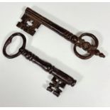 Two large 17thc/18thc. cast iron keys (22cm and 19cm)