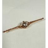 An unmarked but tested 9ct gold Edwardian bar brooch set natural zircon (1.5ct), with open oval