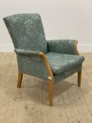 Parker Knoll, a 1960s easy chair, upholstered in teal floral cotton, squab cushion, raised on square
