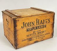 A John Haig's Scotch Whisky case with side handles, hinged lid and 12 inner compartments, the