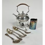 An Edwardian Epns tea kettle complete with stand and burner, with raffia covered handle, raised on