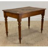 A Victorian pine kitchen table, with rectangular top raised on turned supports H77cm, W109cm, D69cm