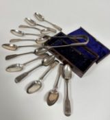 A set of twelve George IV Edinburgh silver fiddle pattern teaspoons with engraved initials GMK,