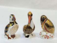 A trio of Royal Crown Derby bone China paperweights comprising a brown Pelican (h- 14cm), a
