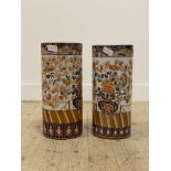 A pair of Chinese porcelain cylindrical umbrella stands, depicting a pot of flowers with birds,