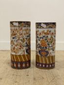 A pair of Chinese porcelain cylindrical umbrella stands, depicting a pot of flowers with birds,