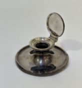 A George V silver capstan inkwell, of characteristic form, hallmarked for Birmingham 1912 (lacking