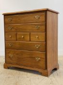 A Georgian style stained hardwood chest fitted with five drawers, raised on bracket supports. H96cm,