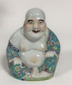 A Chinese happy buddha seated figure decorated in Cantonese style with turquoise blue robe and