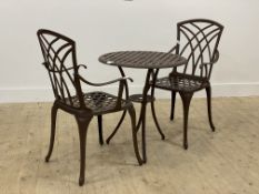 An aluminium garden suite, comprising a pair of chairs with latticed seats and open arms (H90cm) and