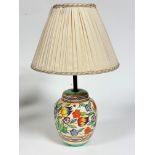 A 1920s/30s pottery ginger jar shaped table lamp base decorated with tulips, cornflowers etc.,