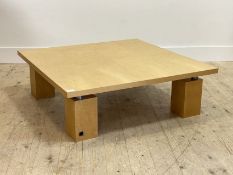 Ligne Roset, A birds eye maple veneered coffee table, the square top raised on block supports,