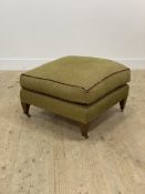A quality footstool of square form, upholstered in spotted green chenille type fabric, raised on