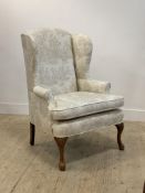 A 20th century Queen Anne style wingback chair, upholstered in ivory toile de jouy, with squab