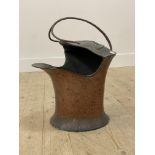 An Art Nouveau period hammered copper coal scuttle with wrought iron handle H50cm