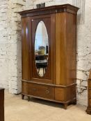 An Edwardian mahogany wardrobe, the dentil cornice over frieze inlaid in the Neoclassical style,