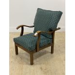 A 1930's/40's oak framed reclining open armchair with upholstered squab cushions. H83cm, W64cm,