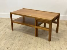 A mid century teak coffee table, the rectangular top on square section supports united by an under