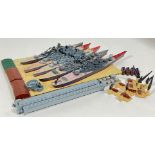 A set of five Triang Minic model toy battleships (largest l- 22cm) and associated accessories