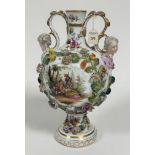 A 19thc Meissen twin handled mask vase of baluster form decorated with handpainted romantic scenes