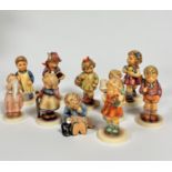 A group of ten Hummel pottery figures, including Garden Treasures, Pixie, A Nap, Puppet Princess