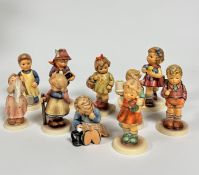 A group of ten Hummel pottery figures, including Garden Treasures, Pixie, A Nap, Puppet Princess