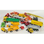 A large collection of model toys comprising industrial vehicles, cranes, diggers, lorries, trucks