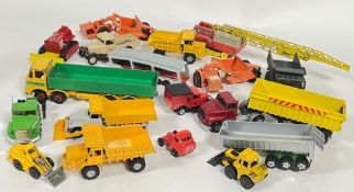 A large collection of model toys comprising industrial vehicles, cranes, diggers, lorries, trucks