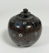 A Japanese Meji period cloisonne ginger jar with stylised butterfly and flower scrolling design